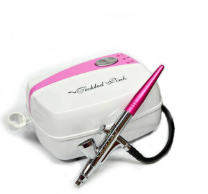 Tickled Pink deluxe airbrush makeup kit is not only affordable but it also includes water-based foundations making it great for those with sensitive skin.
